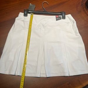 White Under Armour Golf Skort - size M, new with tags.
